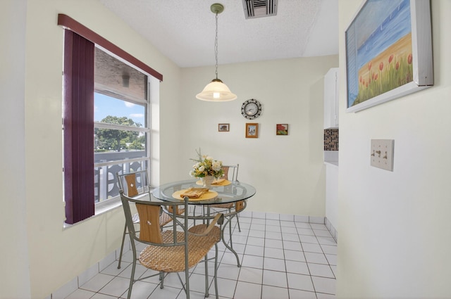 1030 Citrus Way Unit 204, Delray Beach, FL 33445 - dining room with light tile patterned floors and a textured ceiling