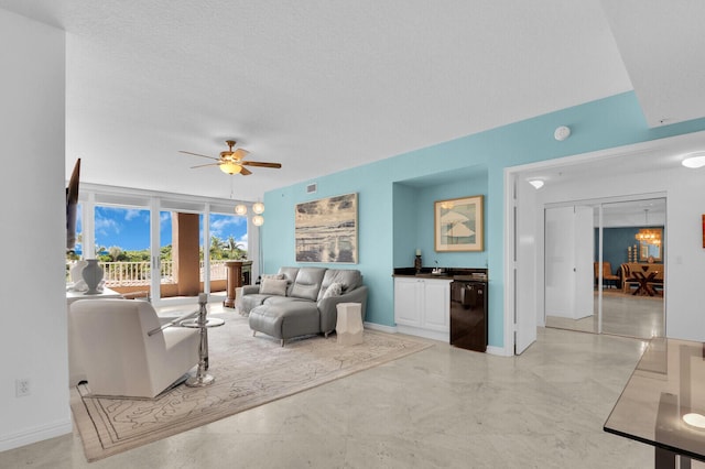700 Ocean Royale Way Unit 202, Juno Beach, FL 33408 - living area with ceiling fan and baseboards