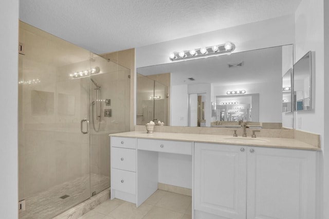 700 Ocean Royale Way Unit 202, Juno Beach, FL 33408 - full bath with a shower stall, tile patterned flooring, vanity, and a textured ceiling