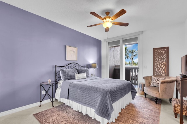 700 Ocean Royale Way Unit 202, Juno Beach, FL 33408 - carpeted bedroom featuring access to outside and ceiling fan