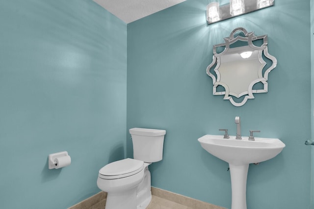 700 Ocean Royale Way Unit 202, Juno Beach, FL 33408 - half bathroom featuring toilet and baseboards