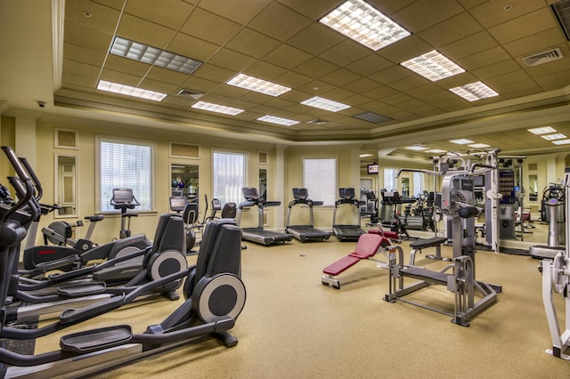 700 Ocean Royale Way Unit 202, Juno Beach, FL 33408 - gym featuring a raised ceiling, a paneled ceiling, and crown molding