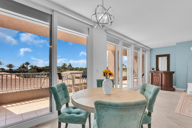 700 Ocean Royale Way Unit 202, Juno Beach, FL 33408 - dining room with a chandelier and baseboards