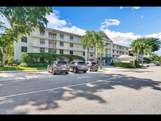 3636 Whitehall Dr Unit 401, West Palm Beach, FL 33401 - view of apartment building / complex featuring uncovered parking