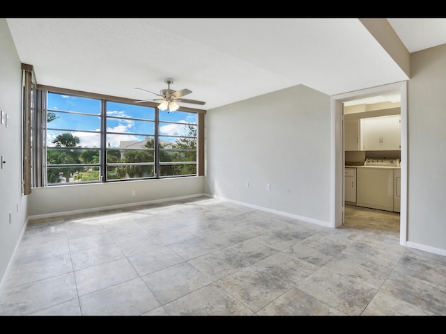 3636 Whitehall Dr Unit 401, West Palm Beach, FL 33401 - spare room with a ceiling fan, washing machine and clothes dryer, and light tile patterned floors
