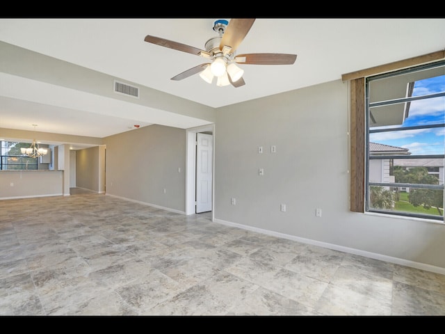 3636 Whitehall Dr Unit 401, West Palm Beach, FL 33401 - unfurnished room featuring a chandelier and ceiling fan