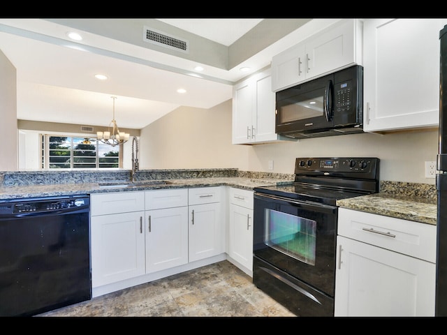 3636 Whitehall Dr Unit 401, West Palm Beach, FL 33401 - kitchen with black appliances, white cabinetry, a chandelier, light stone countertops, and recessed lighting