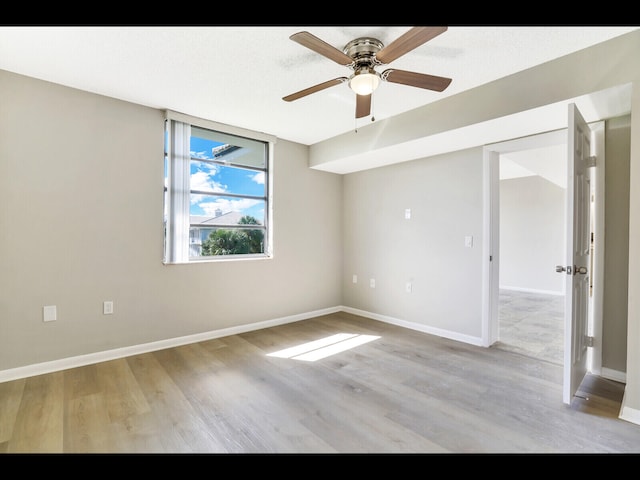 3636 Whitehall Dr Unit 401, West Palm Beach, FL 33401 - unfurnished room featuring light wood finished floors and a ceiling fan