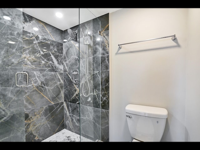 3636 Whitehall Dr Unit 401, West Palm Beach, FL 33401 - bathroom featuring a marble finish shower and toilet