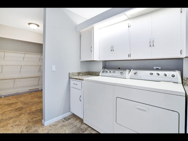 3636 Whitehall Dr Unit 401, West Palm Beach, FL 33401 - laundry room with cabinet space, washer and dryer, and stone finish floors