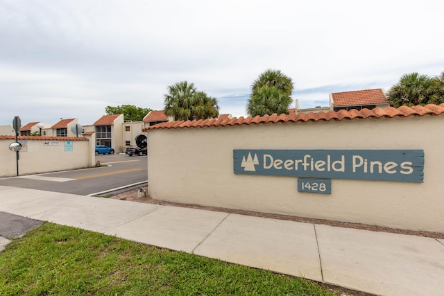 1428 SE 4th Ave Unit 127, Deerfield Beach, FL 33441 - community sign featuring a residential view and uncovered parking
