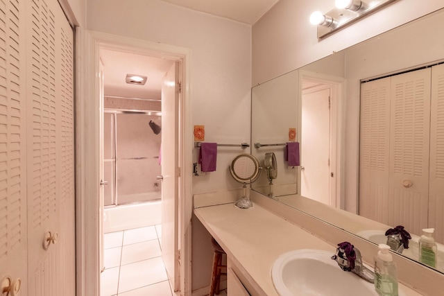 1428 SE 4th Ave Unit 127, Deerfield Beach, FL 33441 - bathroom featuring a closet, tile patterned flooring, vanity, and shower / bath combination with glass door