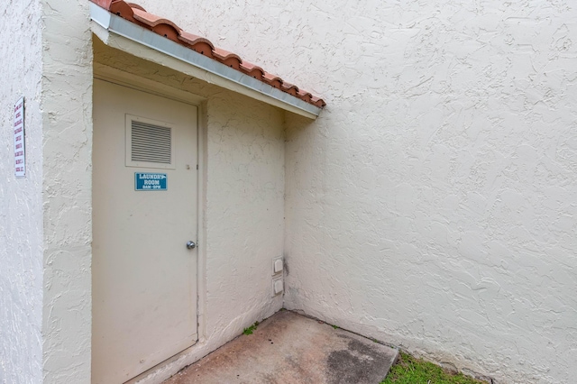 1428 SE 4th Ave Unit 127, Deerfield Beach, FL 33441 - doorway to property featuring stucco siding