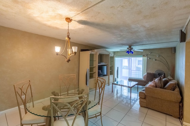 1428 SE 4th Ave Unit 127, Deerfield Beach, FL 33441 - dining area with ceiling fan, light tile patterned flooring, a chandelier, and a textured ceiling