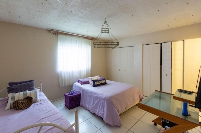 1428 SE 4th Ave Unit 127, Deerfield Beach, FL 33441 - bedroom featuring two closets and light tile patterned floors