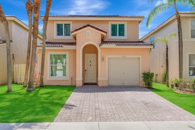 4463 Lake Tahoe Cir, West Palm Beach, FL 33409 - view of front of house featuring decorative driveway, a tiled roof, a garage, and stucco siding