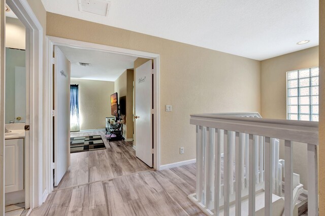 4463 Lake Tahoe Cir, West Palm Beach, FL 33409 - hall featuring light wood-style flooring and baseboards