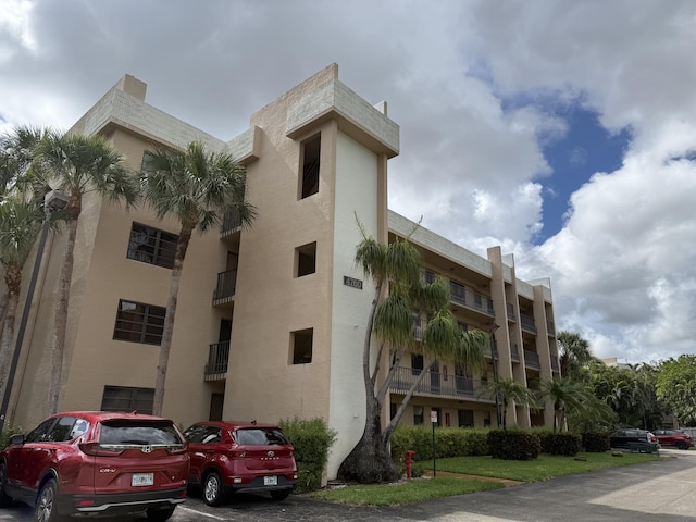4760 Lucerne Lakes Blvd Unit 206, Lake Worth, FL 33467 - view of apartment building / complex featuring uncovered parking