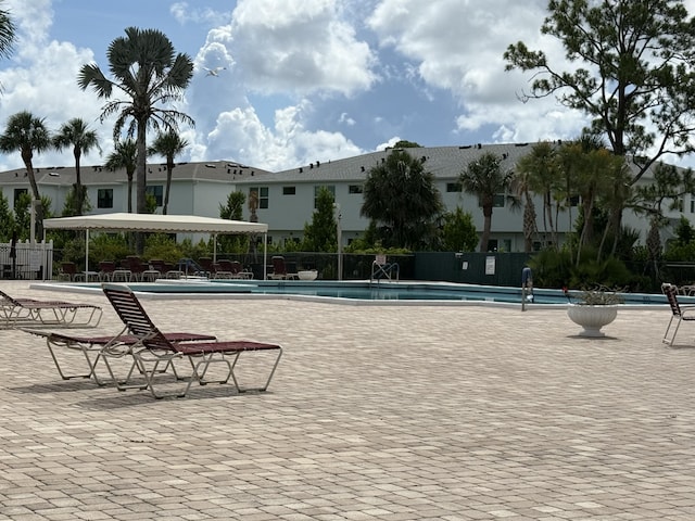 4760 Lucerne Lakes Blvd Unit 206, Lake Worth, FL 33467 - view of property's community with a pool and a patio area