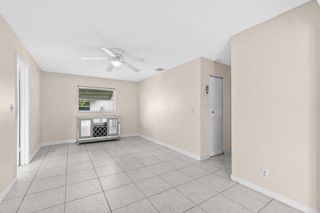 2203 Campanelli Blvd, Boynton Beach, FL 33426 - unfurnished living room featuring a ceiling fan and light tile patterned floors