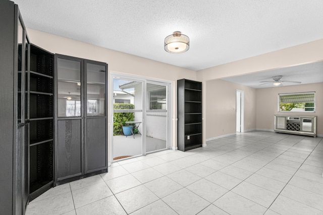 2203 Campanelli Blvd, Boynton Beach, FL 33426 - spare room featuring ceiling fan, a textured ceiling, and light tile patterned floors