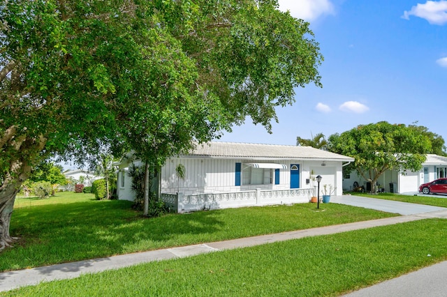 2203 Campanelli Blvd, Boynton Beach, FL 33426 - ranch-style home featuring a front lawn, a garage, and concrete driveway