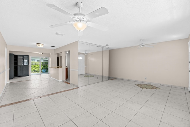 2203 Campanelli Blvd, Boynton Beach, FL 33426 - unfurnished room featuring ceiling fan, light tile patterned floors, and a textured ceiling