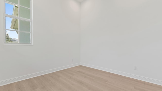 212 SE Via Sangro, Port Saint Lucie, FL 34952 - empty room featuring light wood-style flooring and baseboards