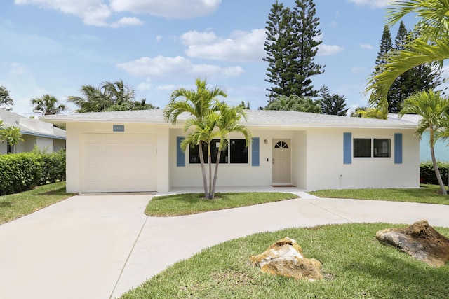 1893 Circle Dr, North Palm Beach, FL 33408 - ranch-style house with driveway, stucco siding, a garage, and a front yard