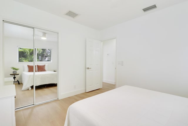 1893 Circle Dr, North Palm Beach, FL 33408 - bedroom featuring light wood-style flooring and a closet