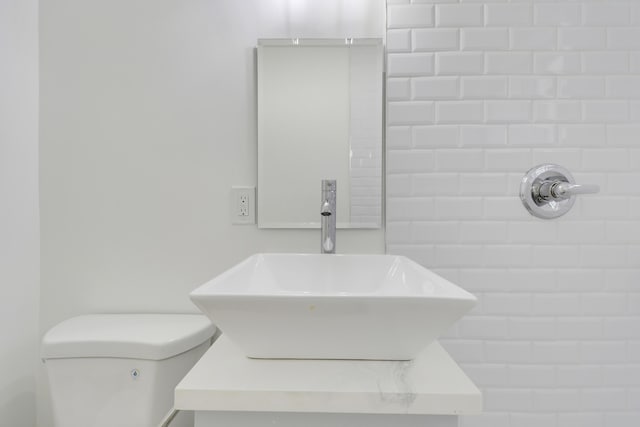 1893 Circle Dr, North Palm Beach, FL 33408 - bathroom featuring toilet and a sink