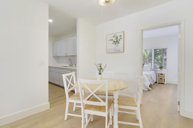 1893 Circle Dr, North Palm Beach, FL 33408 - dining space featuring light wood-style floors and recessed lighting