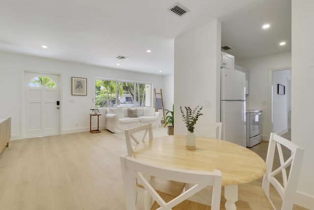 1893 Circle Dr, North Palm Beach, FL 33408 - dining room with plenty of natural light, light wood finished floors, and recessed lighting
