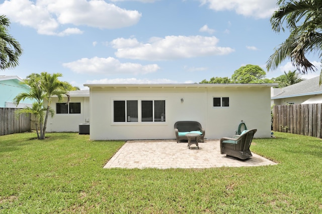 1893 Circle Dr, North Palm Beach, FL 33408 - back of house with stucco siding and a patio area