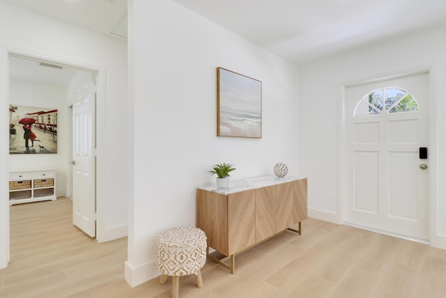 1893 Circle Dr, North Palm Beach, FL 33408 - entryway with light wood-style floors and baseboards