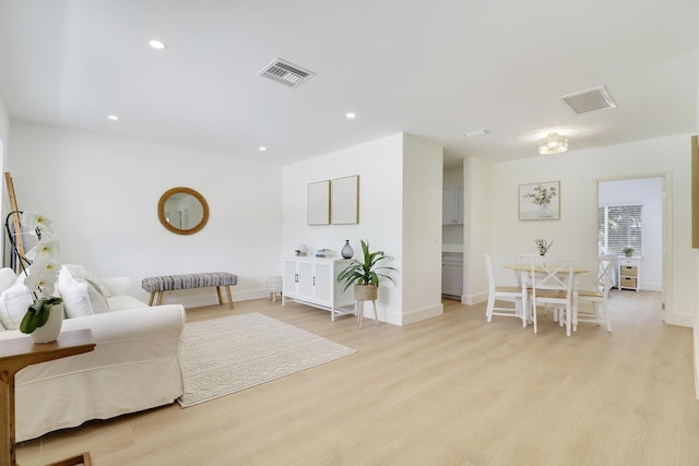 1893 Circle Dr, North Palm Beach, FL 33408 - living room with light wood-style flooring and recessed lighting