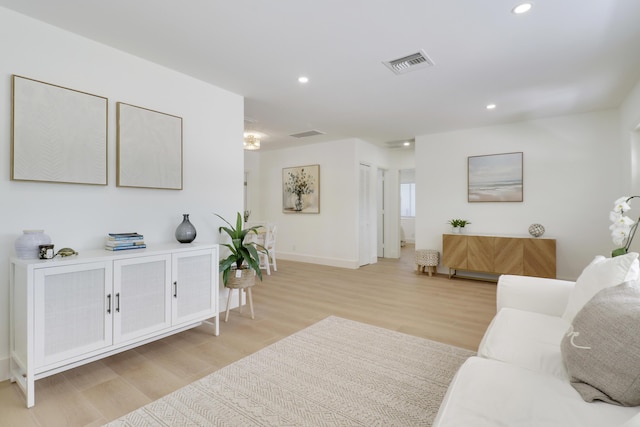 1893 Circle Dr, North Palm Beach, FL 33408 - living area with light wood-type flooring and recessed lighting