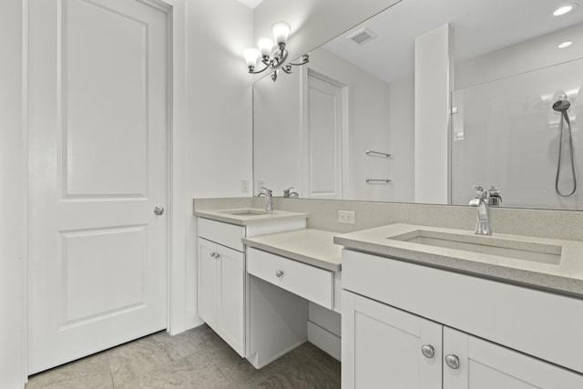 5143 Beckman Ter, Palm Beach Gardens, FL 33418 - bathroom with double vanity, tiled shower, recessed lighting, and tile patterned flooring