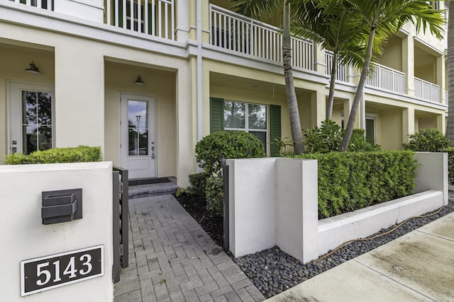 5143 Beckman Ter, Palm Beach Gardens, FL 33418 - doorway to property with stucco siding