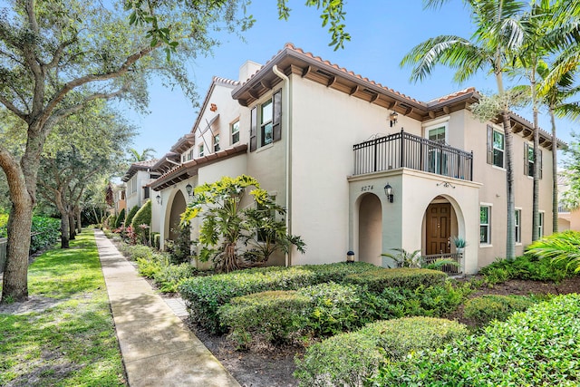 8274 Cascada Isles Dr, Cooper City, FL 33024 - view of front of home with a balcony, stucco siding, and a tile roof