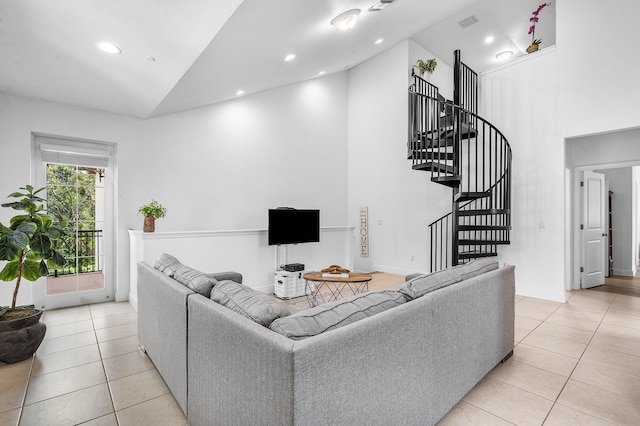 8274 Cascada Isles Dr, Cooper City, FL 33024 - living area with high vaulted ceiling, light tile patterned floors, stairs, and recessed lighting