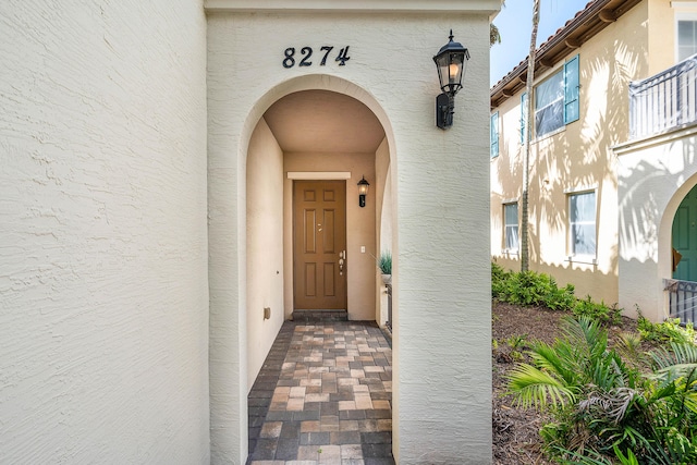 8274 Cascada Isles Dr, Cooper City, FL 33024 - doorway to property with stucco siding