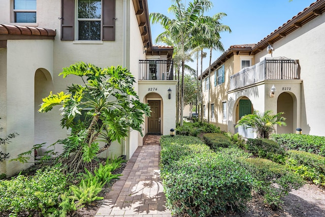 8274 Cascada Isles Dr, Cooper City, FL 33024 - view of front of home featuring a balcony, stucco siding, and a tiled roof
