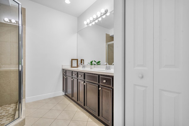8274 Cascada Isles Dr, Cooper City, FL 33024 - bathroom featuring double vanity, a stall shower, and tile patterned floors