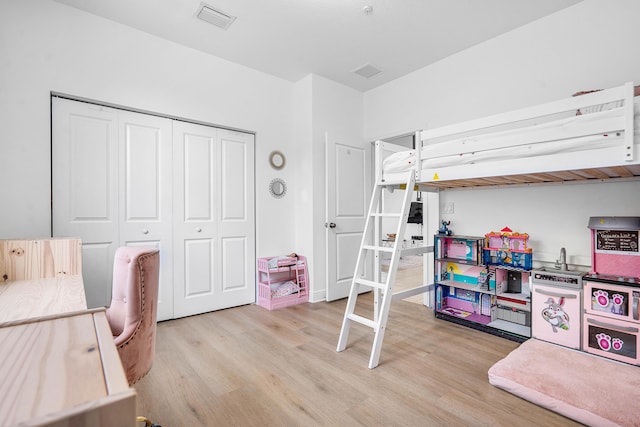 8274 Cascada Isles Dr, Cooper City, FL 33024 - bedroom with light wood-type flooring and a closet