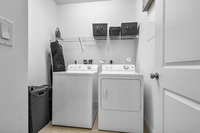 8274 Cascada Isles Dr, Cooper City, FL 33024 - laundry room featuring washing machine and dryer and light tile patterned floors