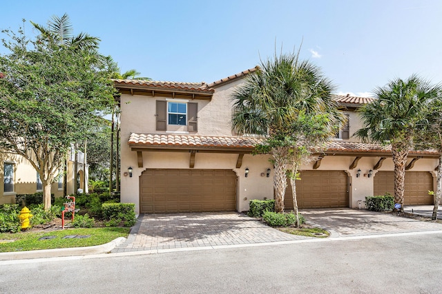 8274 Cascada Isles Dr, Cooper City, FL 33024 - mediterranean / spanish house with a tiled roof, stucco siding, driveway, and an attached garage