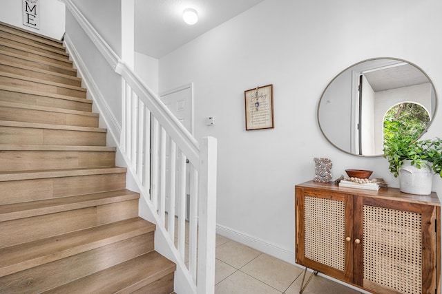 8274 Cascada Isles Dr, Cooper City, FL 33024 - stairway featuring tile patterned flooring and baseboards