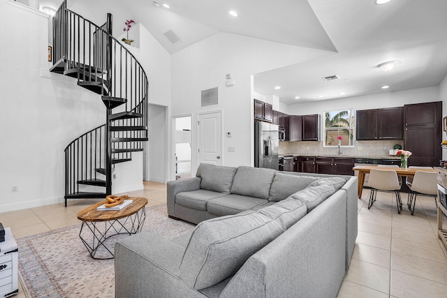 8274 Cascada Isles Dr, Cooper City, FL 33024 - living room with light tile patterned floors, stairway, recessed lighting, and high vaulted ceiling