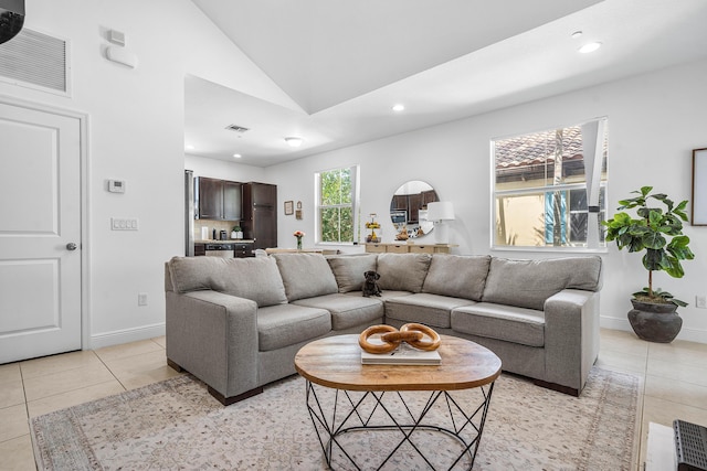 8274 Cascada Isles Dr, Cooper City, FL 33024 - living room featuring light tile patterned floors, vaulted ceiling, and recessed lighting